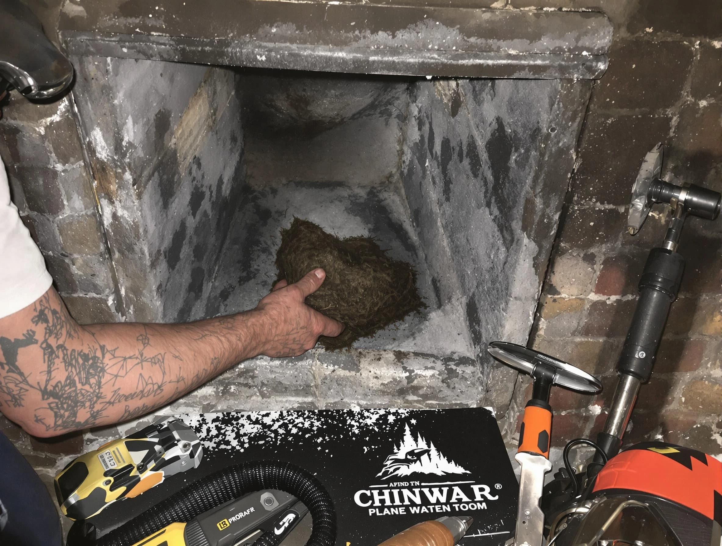 Lynn Chimney Sweep safely removing debris and screening chimney in Lynn, MA